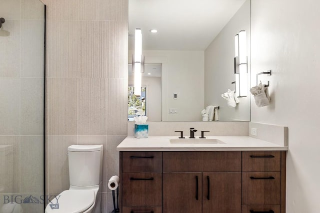 425 Outlook Trl, Big Sky, MT 59716 - full bath with vanity, a tile shower, and tile walls