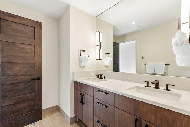 425 Outlook Trl, Big Sky, MT 59716 - bathroom featuring double vanity and recessed lighting