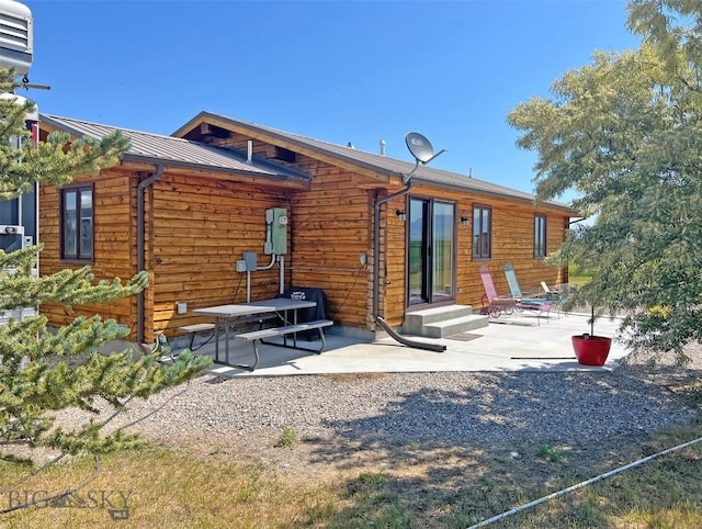 143 Aurora Ln, Dillon, MT 59725 - back of house featuring a patio and a metal roof