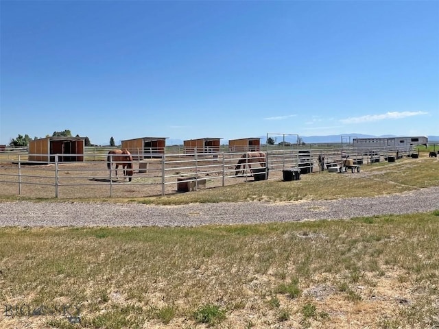 143 Aurora Ln, Dillon, MT 59725 - view of building exterior with an exterior structure and a rural view