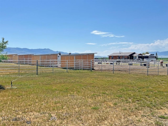 143 Aurora Ln, Dillon, MT 59725 - view of yard featuring an exterior structure, a mountain view, a view of rural / pastoral area, and an outbuilding