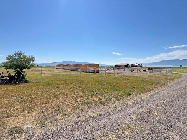 143 Aurora Ln, Dillon, MT 59725 - view of yard with a view of countryside, a mountain view, an outbuilding, and an exterior structure