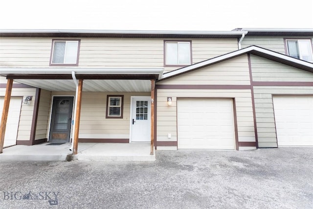 1010 Cruiser Ln Unit M, Belgrade, MT 59714 - view of front of property with covered porch and asphalt driveway