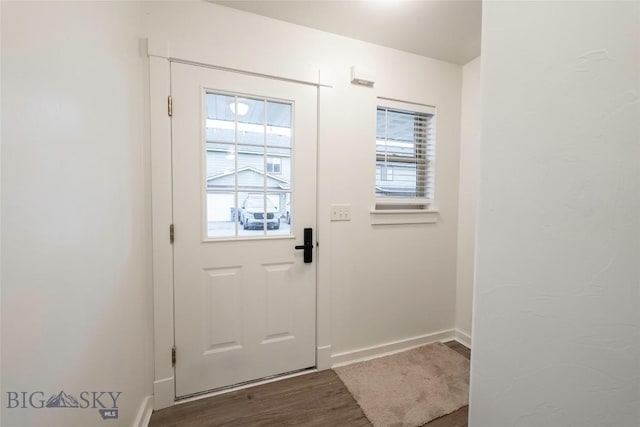 1010 Cruiser Ln Unit M, Belgrade, MT 59714 - doorway to outside with wood finished floors and baseboards