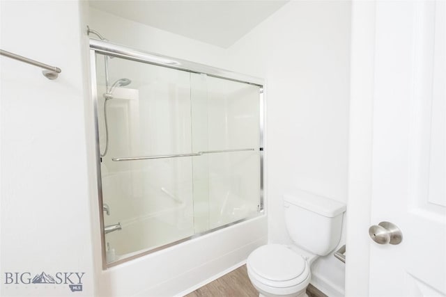1010 Cruiser Ln Unit M, Belgrade, MT 59714 - full bathroom with bath / shower combo with glass door and wood finished floors