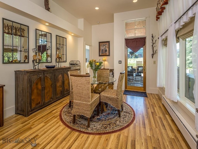 80 Crail Creek Ct Unit 616, Big Sky, MT 59716 - dining space with a baseboard heating unit, light wood-style floors, healthy amount of natural light, and recessed lighting