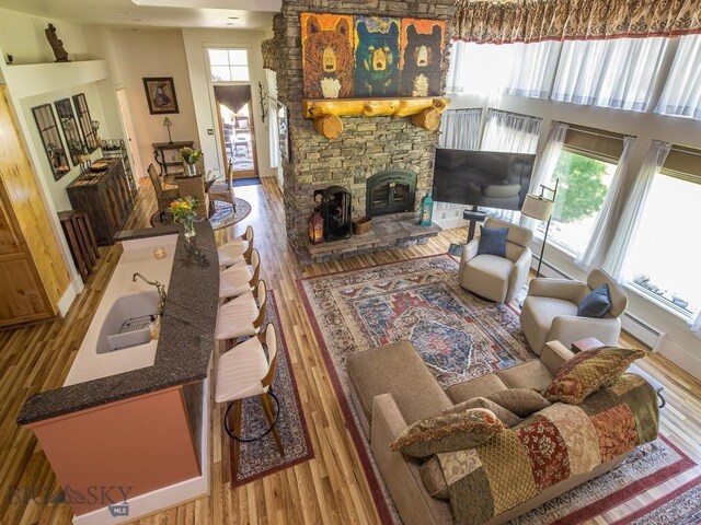 80 Crail Creek Ct Unit 616, Big Sky, MT 59716 - living room with wood finished floors and a wood stove