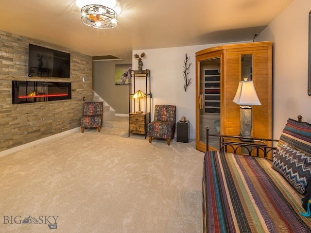 80 Crail Creek Ct Unit 616, Big Sky, MT 59716 - living area with carpet floors, a stone fireplace, and stairway