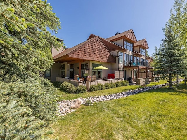 80 Crail Creek Ct Unit 616, Big Sky, MT 59716 - rear view of property featuring a yard and a balcony