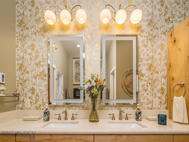 80 Crail Creek Ct Unit 616, Big Sky, MT 59716 - bathroom featuring wallpapered walls and double vanity