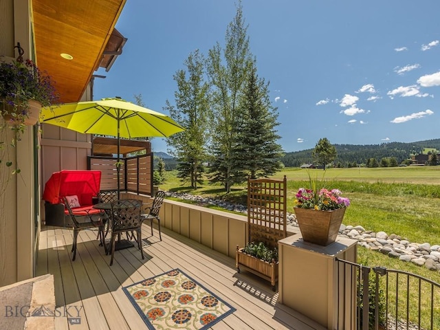 80 Crail Creek Ct Unit 616, Big Sky, MT 59716 - wooden deck featuring outdoor dining space