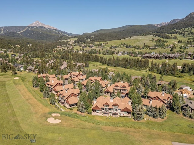 80 Crail Creek Ct Unit 616, Big Sky, MT 59716 - aerial view of property's location with a mountain backdrop and nearby suburban area