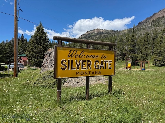 6 Arrowpoint, Silver Gate, MT 59081 - community sign with a mountain view, a view of trees, and a yard