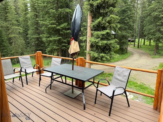 6 Arrowpoint, Silver Gate, MT 59081 - deck with outdoor dining area and a view of trees