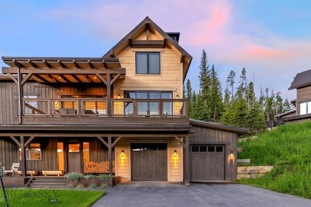580 Outlook Trl Unit 42, Big Sky, MT 59730 - view of front of property with a balcony, board and batten siding, and asphalt driveway