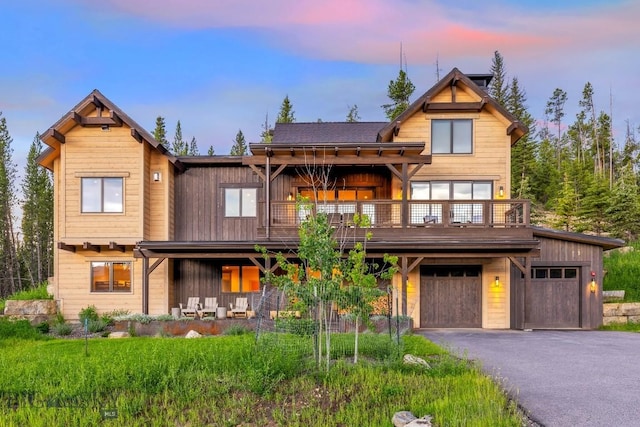 580 Outlook Trl Unit 42, Big Sky, MT 59730 - chalet / cabin featuring driveway and a garage