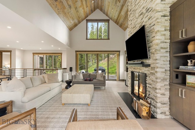 580 Outlook Trl Unit 42, Big Sky, MT 59730 - living area with a fireplace, a towering ceiling, wooden ceiling, and recessed lighting