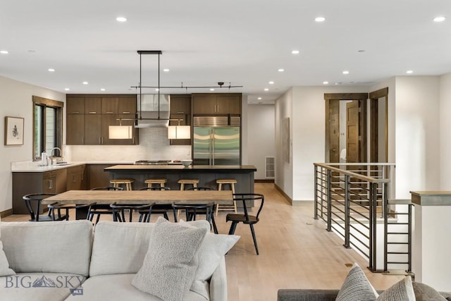 580 Outlook Trl Unit 42, Big Sky, MT 59730 - living room featuring light wood finished floors and recessed lighting