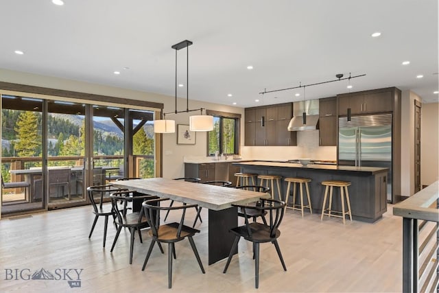 580 Outlook Trl Unit 42, Big Sky, MT 59730 - dining space featuring light wood finished floors and recessed lighting