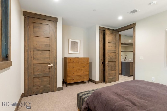 580 Outlook Trl Unit 42, Big Sky, MT 59730 - bedroom with light colored carpet and recessed lighting
