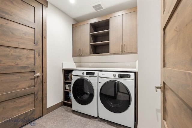 580 Outlook Trl Unit 42, Big Sky, MT 59730 - laundry room featuring separate washer and dryer, cabinet space, and granite floors