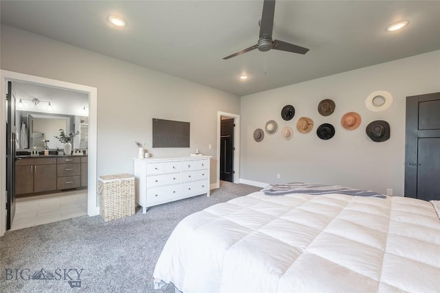 1306 Scooter Ln, Belgrade, MT 59714 - bedroom featuring light carpet, ensuite bathroom, recessed lighting, and ceiling fan
