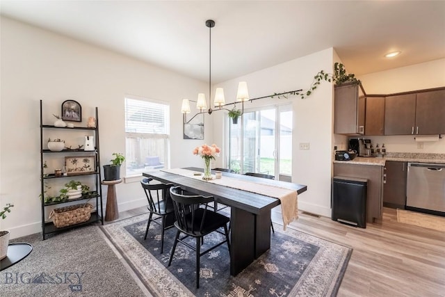 1306 Scooter Ln, Belgrade, MT 59714 - dining space with plenty of natural light, a chandelier, and light wood-style floors