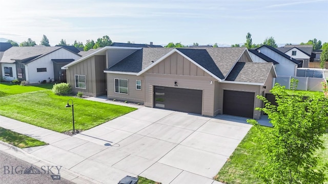 1306 Scooter Ln, Belgrade, MT 59714 - modern farmhouse style home featuring board and batten siding, roof with shingles, a garage, concrete driveway, and a front lawn