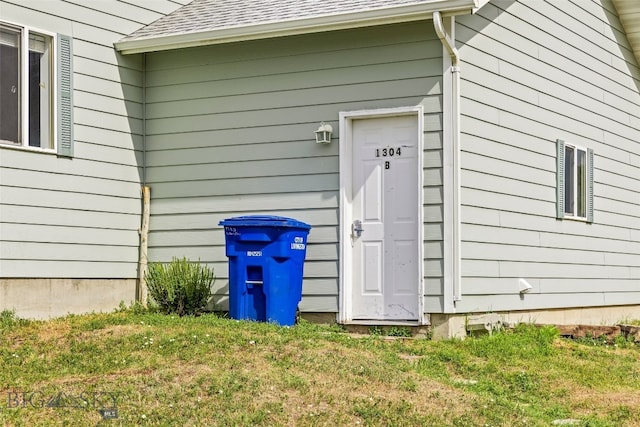 1304 Absaroka Ct, Livingston, MT 59047 - property entrance with a shingled roof and a yard
