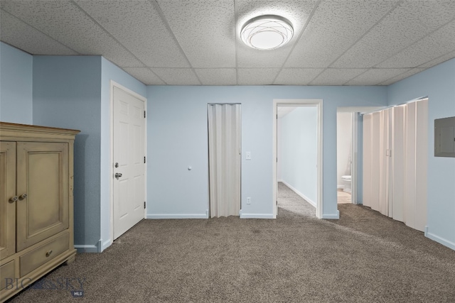 1304 Absaroka Ct, Livingston, MT 59047 - unfurnished bedroom featuring carpet flooring, a paneled ceiling, and electric panel