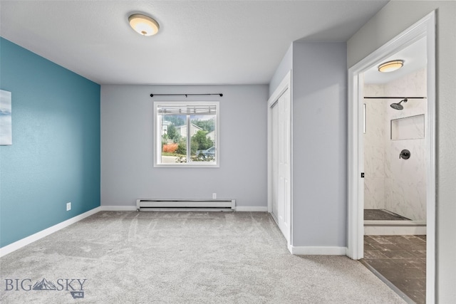1304 Absaroka Ct, Livingston, MT 59047 - unfurnished bedroom featuring a baseboard heating unit, carpet, connected bathroom, and a closet