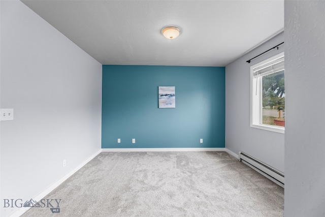 1304 Absaroka Ct, Livingston, MT 59047 - carpeted empty room with a baseboard heating unit and baseboards
