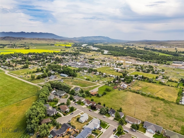 1304 Absaroka Ct, Livingston, MT 59047 - aerial view of property's location featuring a mountain backdrop and nearby suburban area