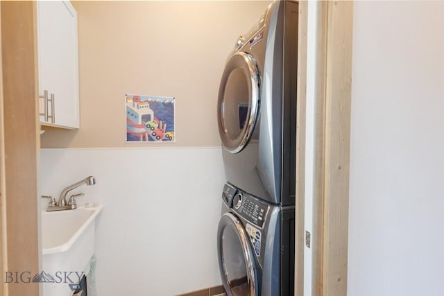 182 Snowy Owl Trl, Bozeman, MT 59718 - washroom featuring estacked washer and dryer and a sink