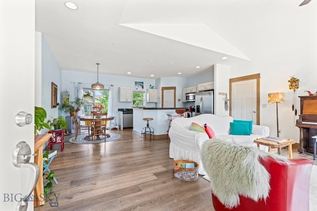 182 Snowy Owl Trl, Bozeman, MT 59718 - living room featuring wood finished floors and recessed lighting