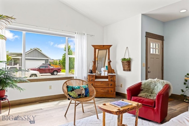 182 Snowy Owl Trl, Bozeman, MT 59718 - sitting room with wood finished floors and vaulted ceiling