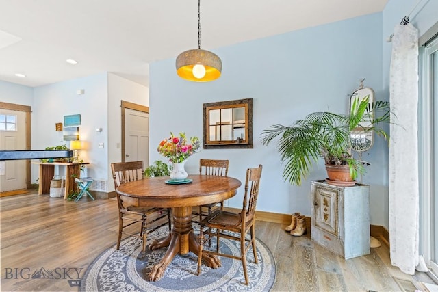 182 Snowy Owl Trl, Bozeman, MT 59718 - dining space with light wood-style floors and recessed lighting
