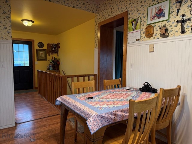 185 Howie Rd, Big Timber, MT 59011 - dining room with a wainscoted wall, wood finished floors, and wallpapered walls