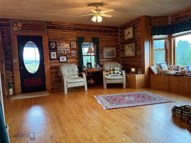 185 Howie Rd, Big Timber, MT 59011 - foyer entrance featuring wooden ceiling, a ceiling fan, wood-type flooring, and log walls