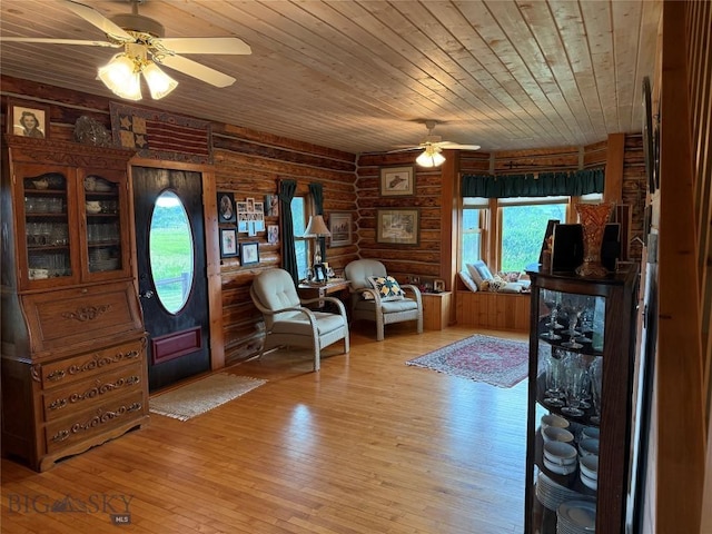 185 Howie Rd, Big Timber, MT 59011 - foyer with wood ceiling, a ceiling fan, light wood-style flooring, and rustic walls