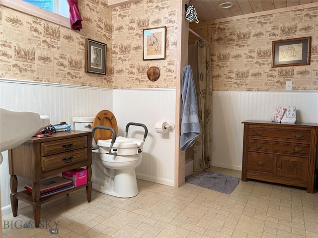 185 Howie Rd, Big Timber, MT 59011 - full bathroom featuring wallpapered walls, a wainscoted wall, and a shower with curtain