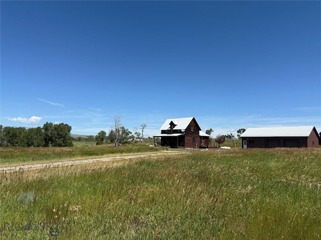 185 Howie Rd, Big Timber, MT 59011 - view of yard with a barn, an outbuilding, and a view of rural / pastoral area