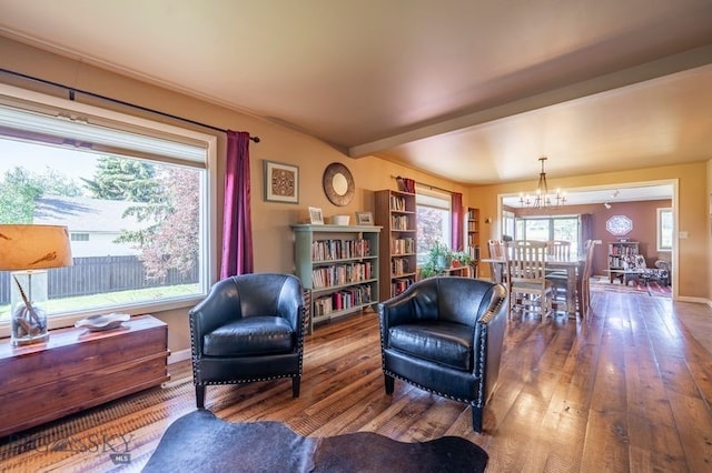 302 Ordway St S, Wilsall, MT 59086 - living area with hardwood / wood-style floors, a chandelier, and beam ceiling