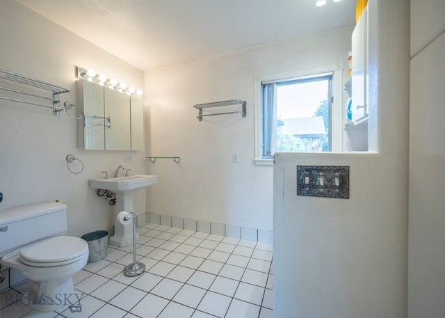 302 Ordway St S, Wilsall, MT 59086 - half bathroom with toilet and tile patterned floors