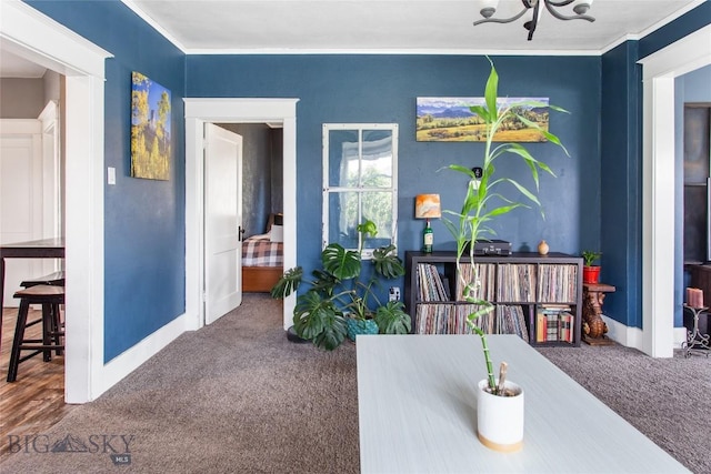 221 E Front, Butte, MT 59701 - carpeted dining area with ornamental molding and a chandelier