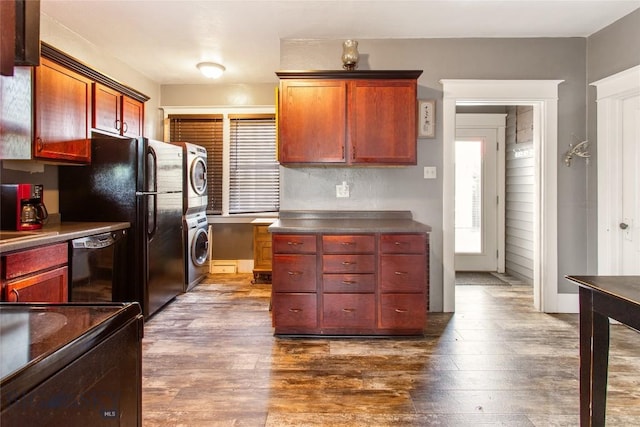 221 E Front, Butte, MT 59701 - kitchen with stacked washing machine and dryer, dishwasher, dark wood-type flooring, and dark countertops