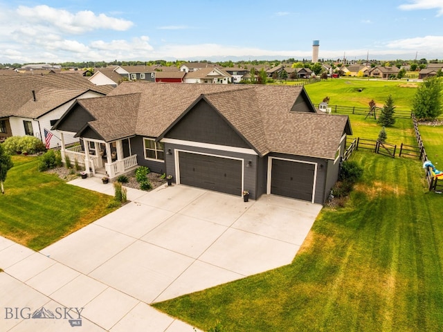 138 E Shade Tree Ln, Manhattan, MT 59741 - view of front of property with a garage, a residential view, concrete driveway, and roof with shingles