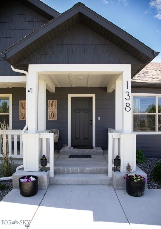 138 E Shade Tree Ln, Manhattan, MT 59741 - doorway to property with a porch