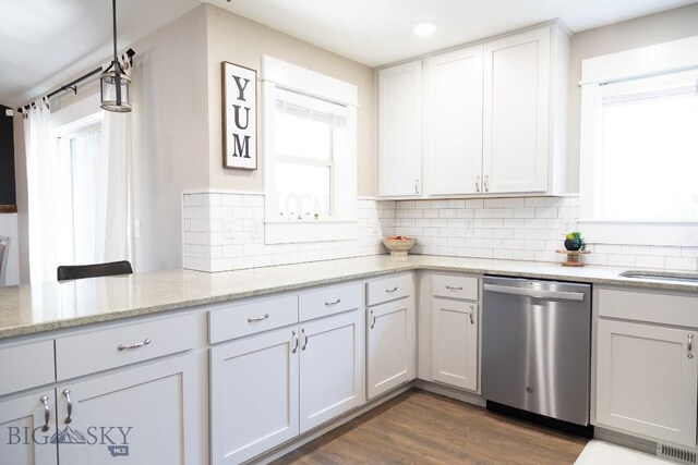 138 E Shade Tree Ln, Manhattan, MT 59741 - kitchen featuring dishwasher, plenty of natural light, tasteful backsplash, light stone countertops, and recessed lighting