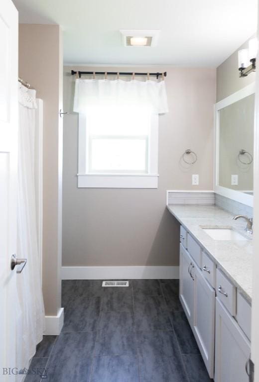 138 E Shade Tree Ln, Manhattan, MT 59741 - bathroom featuring vanity and baseboards